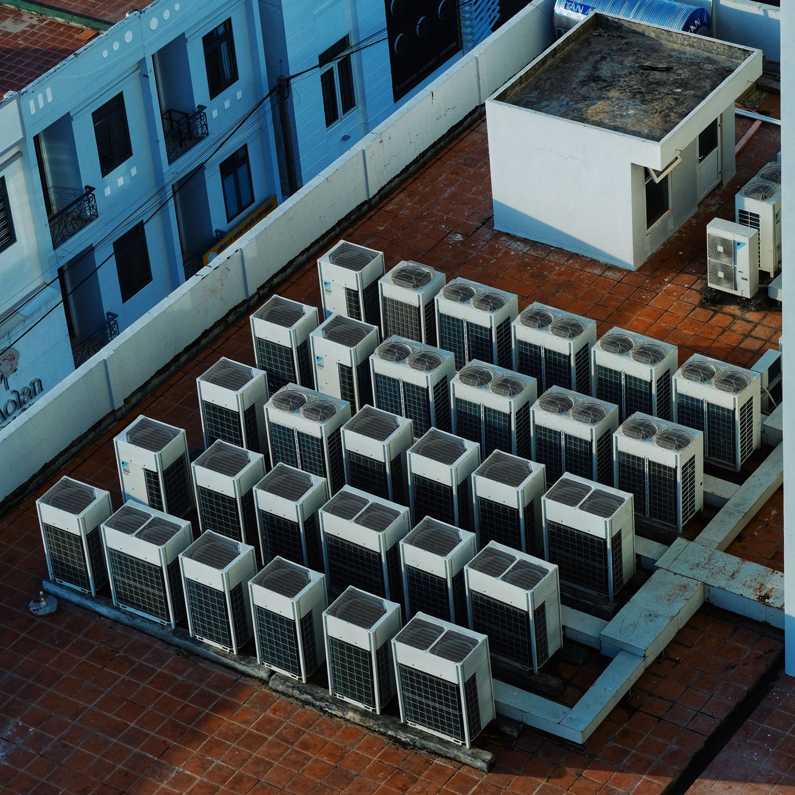 Roof-mounted outdoor HVAC units arranged in rows