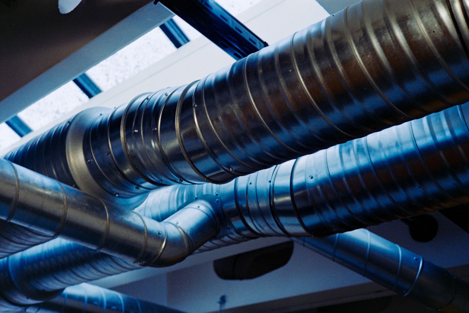 Metal air-distribution ducts overhead