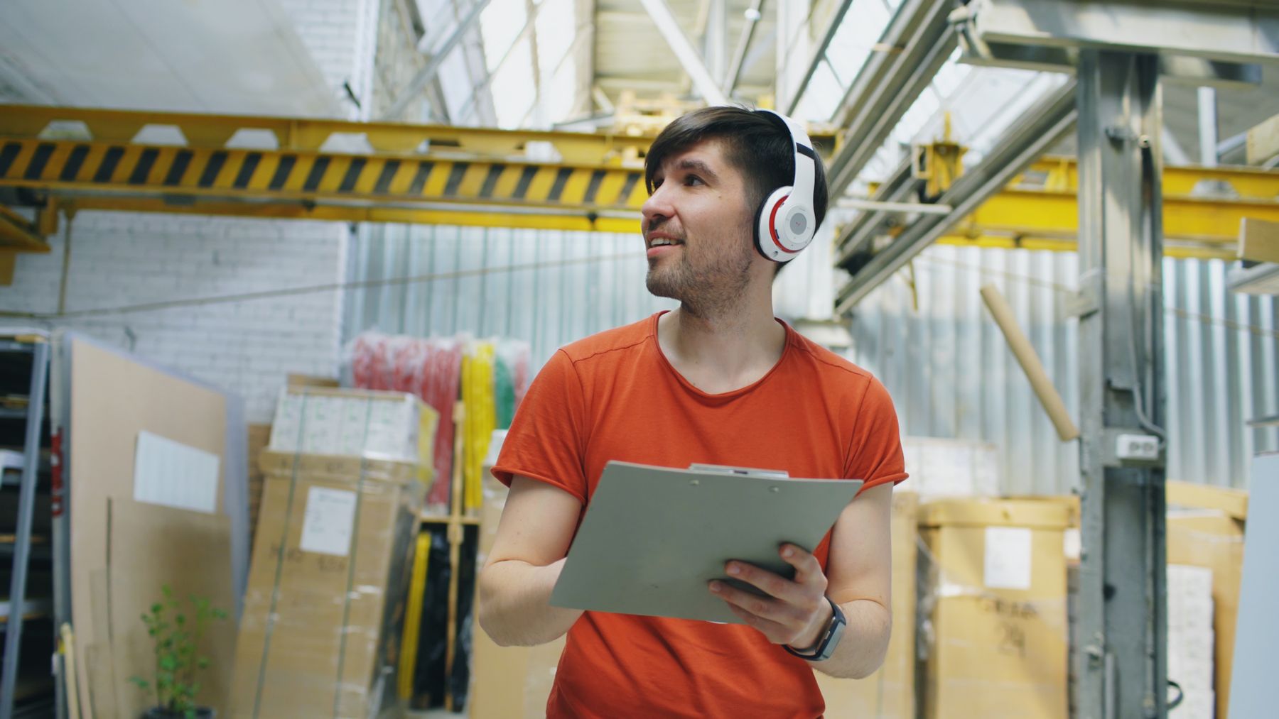Warehouse worker checking a clipboard